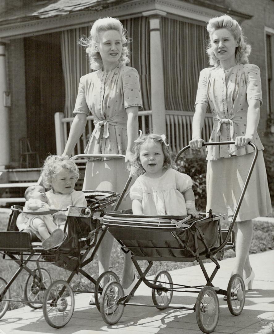 Out for stroll Mrs. Gray and Carol Ann are on the left this time. The sisters come from a theatrical family. They were married in a double ceremony at Croydon, England