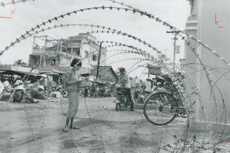 Life goes on in South Viet Nam, two years after a ceasefire which still produces 6,000 casualties a week