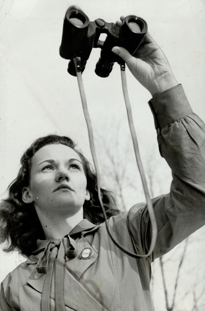 Binoculars and parachutes are study for these girls in war effort, On many fronts the Canadian girl is giving her best to help the war such as the bin(...)