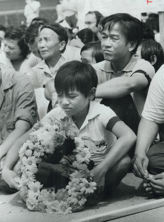 Cam Xuong Luong, 8, lead rally at City Hall pleading for help for Vietnamese refugees