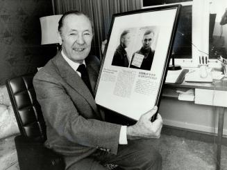 Flashback: Weidauer with wartime newspaper account of his recapture after he escaped and hid for several weeks on a sheep ranch