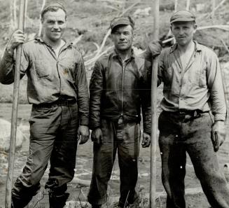 On the Jackfish river in the Nipigon country, Nazi war prisoners work on the log drive