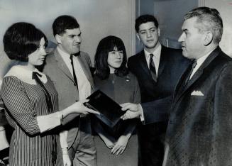 Born in Bergen-Belsen concentration camp, these four Toronto teenagers look at the official record of the prison camp held in David Goldsilver, vice-p(...)