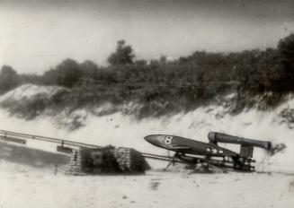 Buzz-Bomb, built by the U.S. Army Air Force and adapted from the Nazi terror-weapon, may soon outrocket the German make. It is shown here before launching