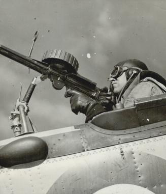 Above is a gunner in the cockpit of a reconnaissance seaplane based on Lake Ontario's shores adjacent to the Trenton flying field