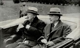 Representing Canada at the conference, Premier King rides through Quebec streets with England's Premier Churchill to pay a formal call on Sir Eugene F(...)