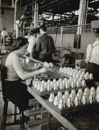 Part of a shel cap assembly line