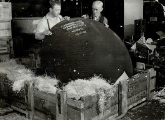 The concave mirror of an anti-aircraft searchlight sends out beams visible 75 miles away