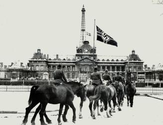 The Eiffel tower, famous Parisian landmark, upon which Berlin reportedly has salvage designs, is seen in the background