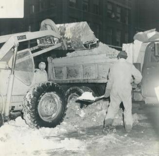 Making snow go so traffic can flow is the job of this team of man and truck