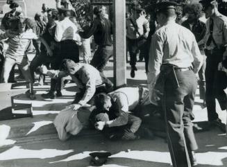 Mailbox was overturned in a scuffle between police and evicted campers yesterday morning in front of the Central Library, where one constable used his(...)