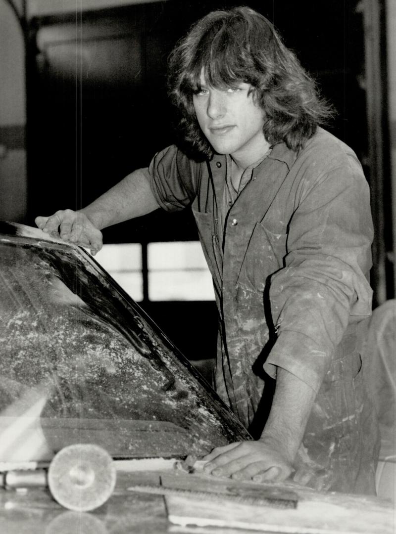 Earning and learning: Rob Collum, 17, is learning the auto body trade at Centre for Advancement in Work and Living, one of hundreds of unemployed youths on their way to a job