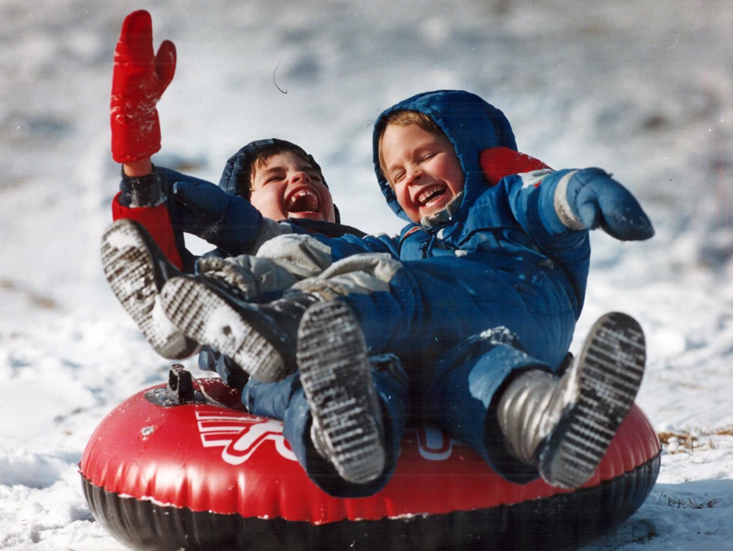 It's hard to tell which limb belongs where as Jonathan and David McQuaid ace a landing after skidding down the tobogganing hill at Riverdale Park yest(...)