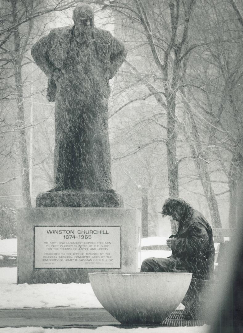 Boris Spremo wins for a portrait of a man beneath a legend