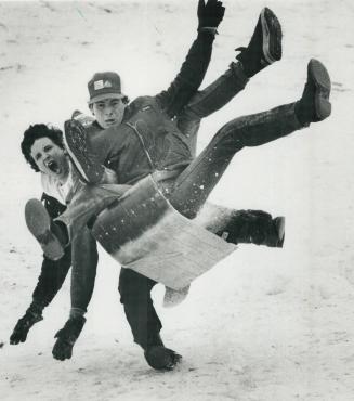 The weekend's snowfall found some sledders eager to roar, including this trio flying down a slope in Riverdale Park