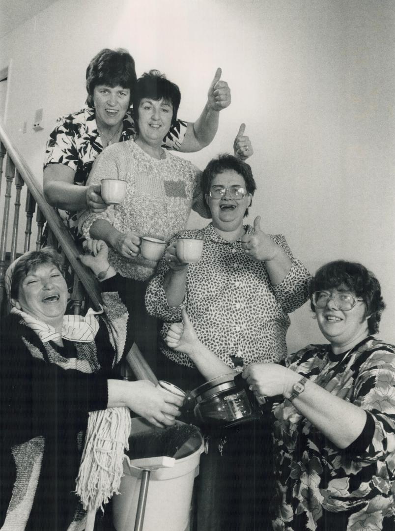 Cheers! Raising a cup today to toast the settlement that gives them a big pay increase are, from left, Toni Pelleja, Ida Laws, Sadie Lawlor, Joan Masters and Jean Steven