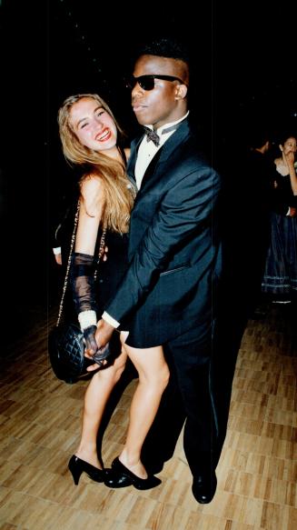 Prom fever: Northern Secondary students Donnovan Green and Lalena Bennett, both 19, cavort on the dance floor at the Royal York