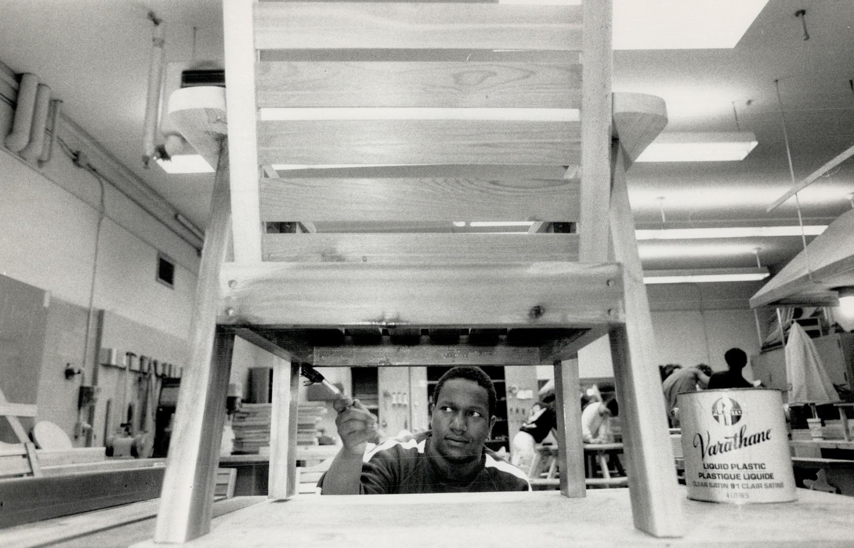 Furniture for sale, Anthony Wilson of North York applies a coast of varnish to a cedar patio chair at the Core Foundation Wood Shop, which is having a(...)