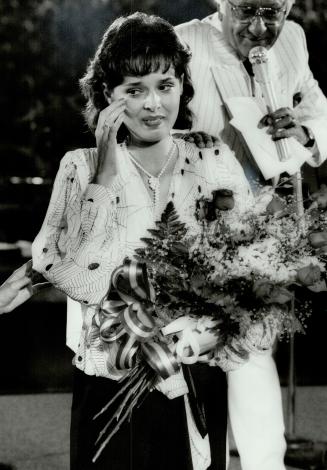 Victory tears: Paola Di Felice wipes away tears of relief after hearing the announcement that she had won the title Miss Chin Italia 1984 at Ontario Place yesterday