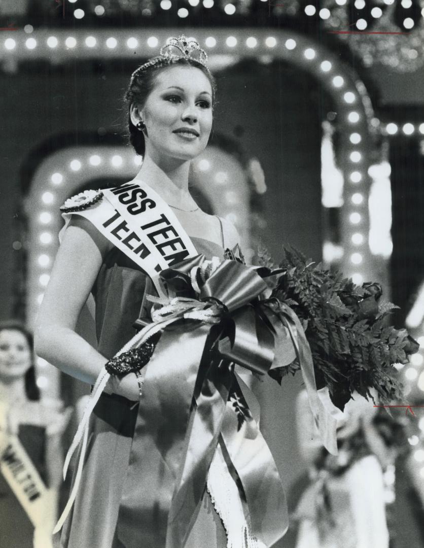 Teen queen, Jody Trammell, a 17-year-old Vancouver high school student, puts on a regal air moments after winning the Miss Teen Canada title in Metro last night