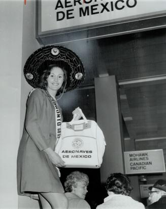 Mexico-bound, Carol Ann Robertson, Miss Toronto, leaves yesterday for Tampico, Mexico, to take part in the city's Mardi Gras celebrations