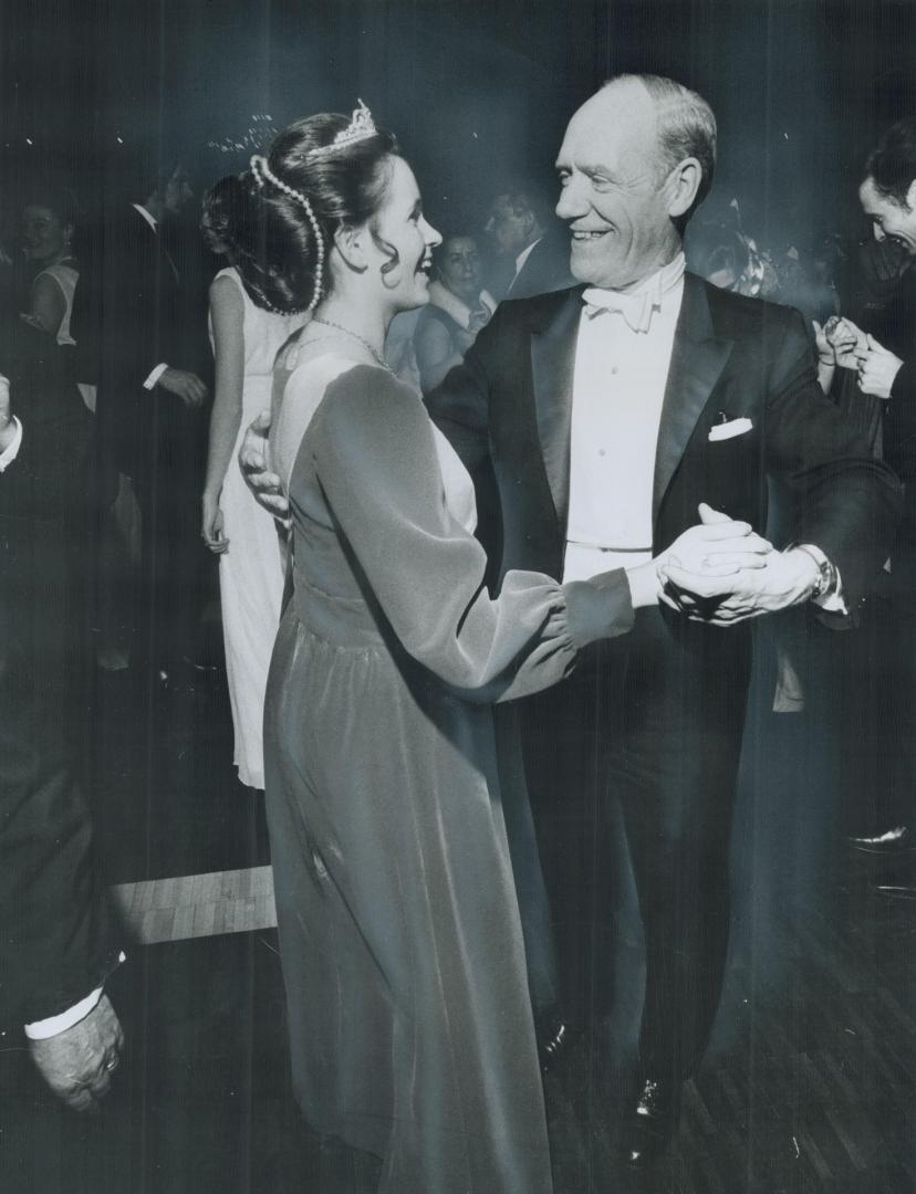 Crowned Miss Helicon 1971, Mary Dencshazi, a 21-year-old York University student, dances with External Affairs Minister Mitchell Sharp during Saturday(...)