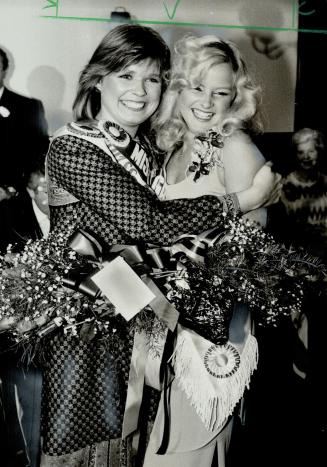 New luck? The new Miss Argo, 21-year-old Darlene Heaslip, gets a congratulatory hug from her predecessor, Susan Spencer, after being chosen last night(...)