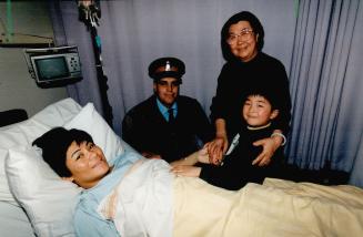 Saved baby: Kelvin Kwan, 5, grandma Yuan Yi Kwan, and Metro officer Peter Moreira smile after helping mom Eva Kwan deliver a baby yesterday