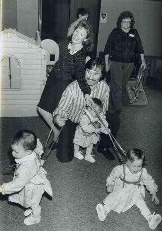 A handful of valentines, Donna and Louis Zidar of Brampton try to control quads Deanna, Lisa, Catherine and Jonathan (behind his mom) yesterday at the(...)