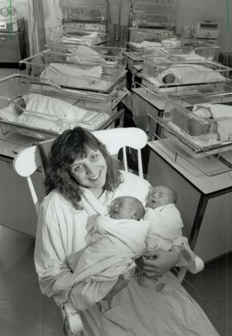 Maternity ward: Sarina Zappone, 28, proudly shows off her newborn twin boys, Alexander, left, and Andrew who were born Monday at Mount Sinai Hospital