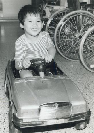 Cruisin' down the hallway, Lin Htut, the brother half of the Siamese twins from Burma who were separated in 1984 at Sick Children's Hospital, roars th(...)