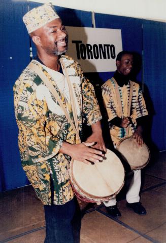 Quammie Williams and Sone Jume, 15, drum up enthusiasm last night to Metro Hall to celebrate the launch of Black History Month. Story, B4