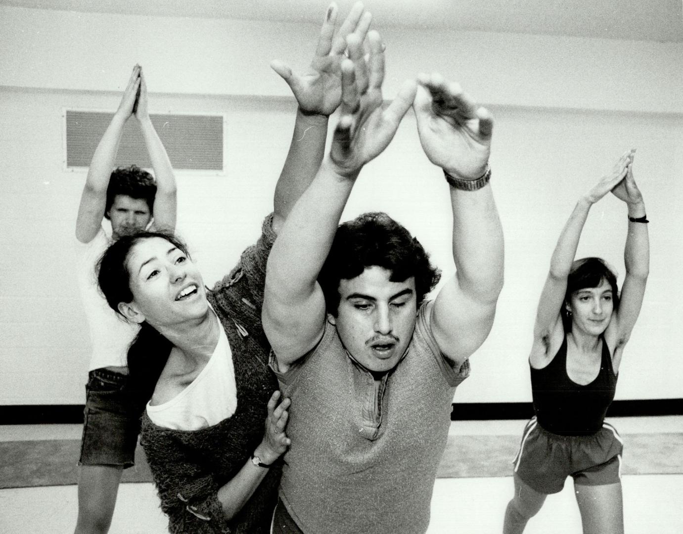 Getting The Point: Choreographer Maxine Heppner shows blind actor Ken Burgess the correct position in rehearsals for the musical The Point, while, behind, Aida Jordao helps David Loveridge, left