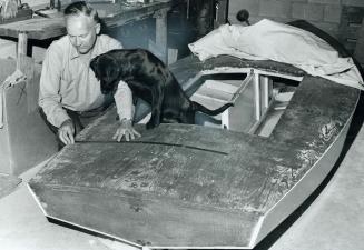 Using a braille tape to measure the deck of the Dart class yacht he is building, Hugh Russel, blind national director of employment for the Canadian N(...)