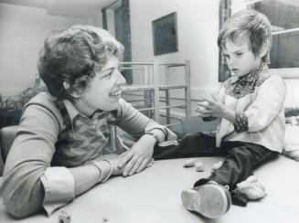 Getting the feel of modelling shapes in kindergarten clay is Jennifer Boag, 3, a blind child attending the day care and assessment centre operated by (...)