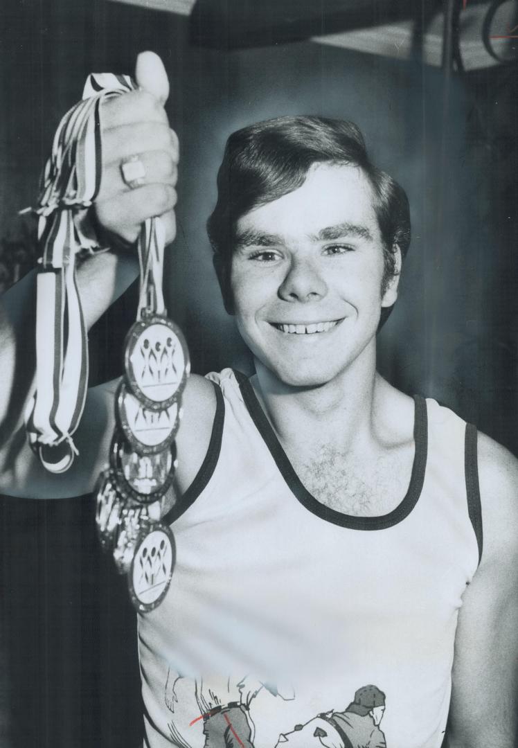 Blind athelete Ray Jackson, 19, shows the medals he's won in the past two years in the Ontario Games for the Disabled