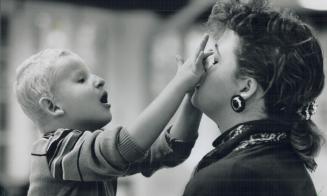 Four-year-old Michael Lupolvici calls out the names as Linda Dearlove teaches him the parts of her face