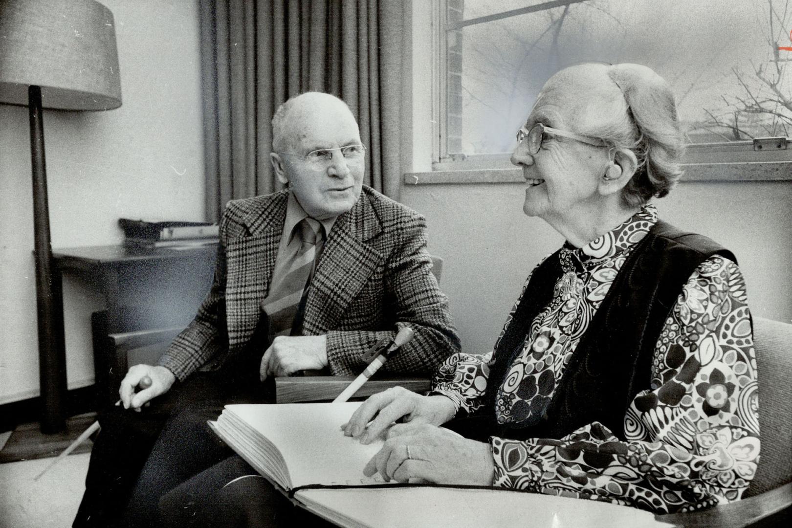 Mrs. Frances Lloyd, 78, reads to her 81-year-old husband, Walter, from a Braille book at the Canadian National Institute for the Blind. Mrs. Lloyd, wh(...)