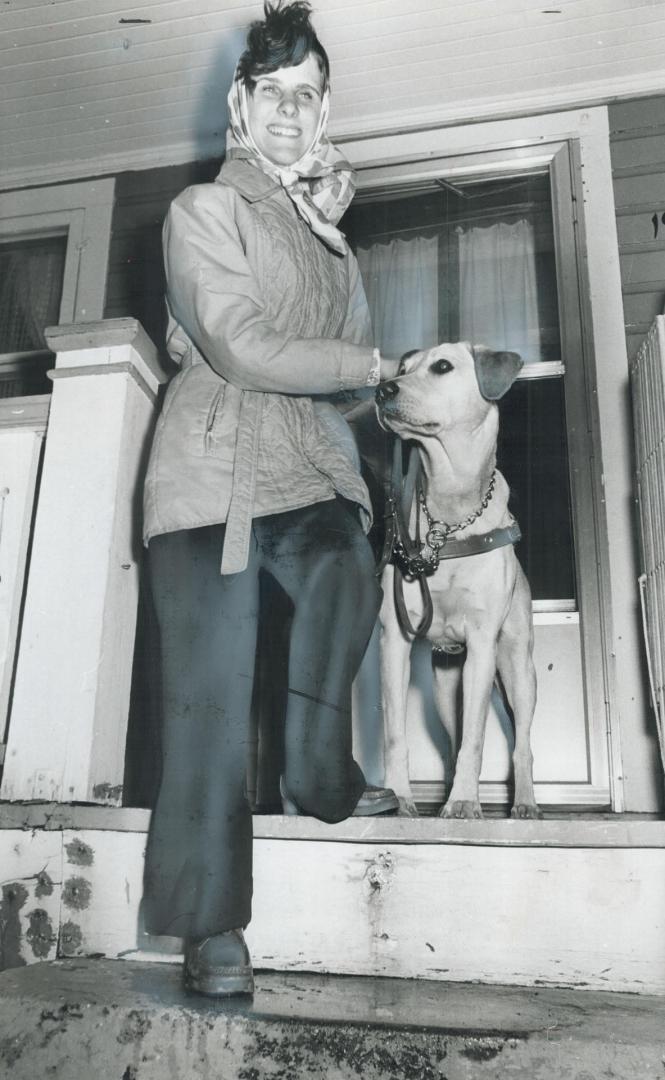 Blind since birth, Diane Motchuk, 21, steps out of her home for the first time with Katrina, a 60-pound golden labrador that will be her guide dog. Sh(...)