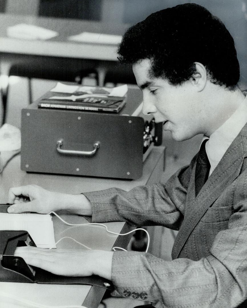 Rejean Proulx, a 20-year-old university student from Hearst who has been blind since birth, reads with an Optecon machine at the Canadian National Ins(...)