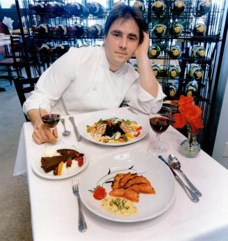 Creative Cuisine: Mike Davies, chef at The Keystone Alley Cafe, shows off medallions of veal with squid linguine, gravad lox, and bittersweet chocolate flan