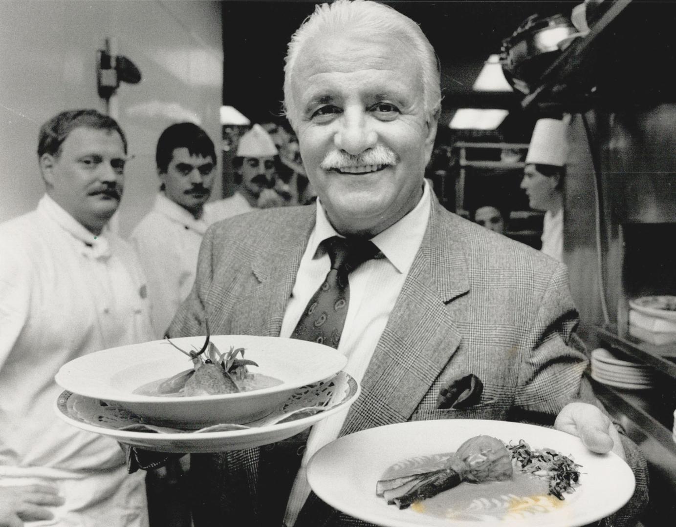 Full Plate: French chef-entrepreneur Roger Verge, in Toronto for a special promotion, holds a fricassee of lobster, left and zucchini blossom stuffed with truffles