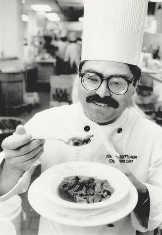 Taste test: Chef Dominic Zoffranieri samples the Lamb Estouffade he is making at the International Food And Wine Fair this weekend at the Coliseum at Exhibition Place