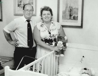 Empty nursery: Zosia and Mel Ettenberg stand in the room they have ready for Richard, 1,-near right, and Benjamin, 2, the adopted sons they had to leave in a Polish orphanage