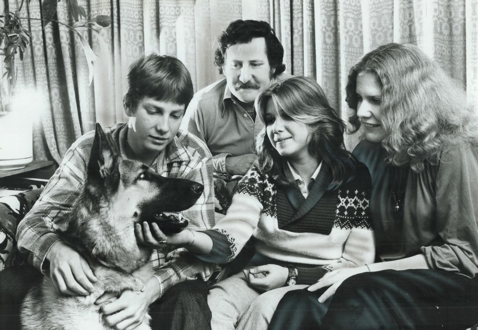 Happy father, Nicholas Pawley, rear, and his second wife, Christine, right, and family pet Anais relax at their Moberly Ave. home after Pawley brought(...)