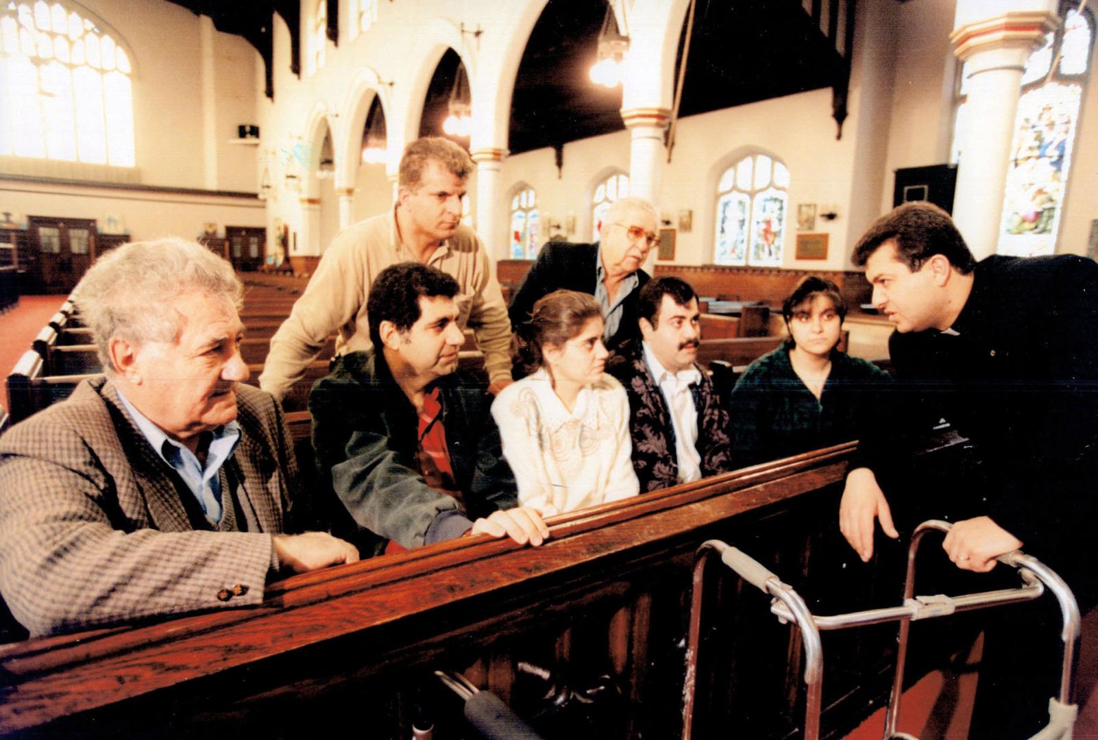 Father George Ayoub (right) & Bahscus family