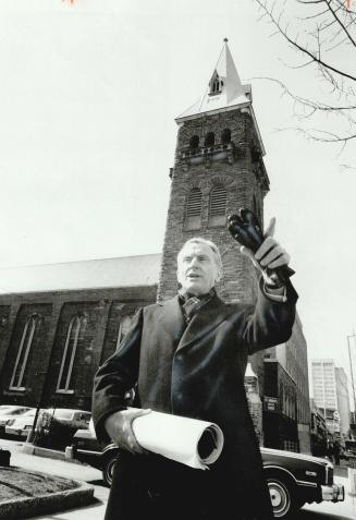 Rev. Richard H. N. Davidson outside St. Andrew's United Church on Bloor St