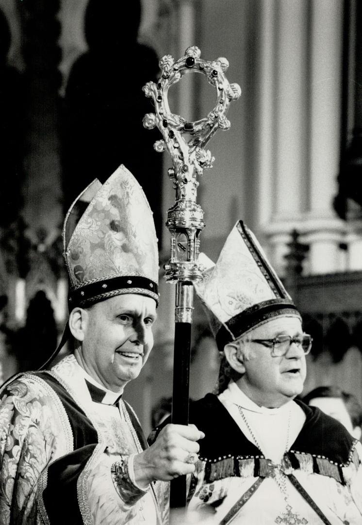 Bishop Installed, Rt. Rev. Terence Finlay holds crozier beside Metropolitan John Bothwell after becoming Toronto's 10th Anglican bishop last night, succeeding Lewis Garnsworthy