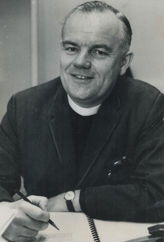 Toronto's Rev. Ernest Harrison at Work at his Desk, He writes Sunday-school material full-time, mysteries in his spare-time