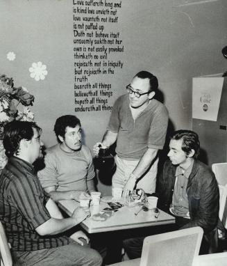 Pastor to hippies, Rev. George Leroy serves coffee to Lance Edwards, Dave Colby and Norm Dickson at Leroy's coffee house, The Stepping Stone, in Toronto's Yorkville area. The coffee is free